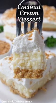 a piece of coconut cream dessert being held by a fork