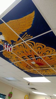 an eagle painted on the ceiling of a classroom