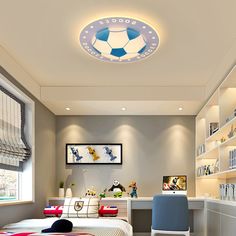 a bedroom with a soccer themed ceiling light above the bed and desk in front of it