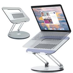 an open laptop computer sitting on top of a stand