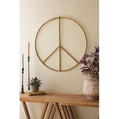 Peace, please. Hang a three-pronged peace sign to signal universal goodwill or invite some peace into your life. Handcrafted in Haiti, this seagrass and iron wall hanging is the perfect touch for a teen's living space, spa retreat, or any groovy room. | Bay Isle Home™ On Metal 0.5 H x 28.5 W x 28.5 D in gray / yellowMetal in Gold | 0.5" H X 28.5" W | Wayfair Groovy Room, Nature Wall Decor, Bird Wall Decor, Spa Retreat, Accent Wall Decor, Design Toscano, Wall Decor Set, Flower Wall Decor, Nature Wall