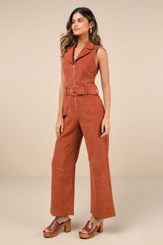 Let everyone know you're a confident cutie with the Lulus Energetic Appeal Rust Orange Corduroy Sleeveless Belted Jumpsuit! Classic corduroy fabric shapes a sleeveless bodice with a collared neckline, notched lapels, and flattering princess seams. Belt loops and a wide statement belt (with a covered buckle) accent the waist, atop wide legs with functional front and back patch pockets. Full-length hems. Exposed gold zipper at the front. Fit: This garment fits true to size. Length: Ankle length. S Sleeveless Brown Jumpsuits For Workwear, Trendy Sleeveless Jumpsuits And Rompers For Fall, Rust Jumpsuit, Corduroy Jumpsuit, Wineries Outfit, Jumpsuit With Belt, Orange Jumpsuit, Statement Belt, Belted Jumpsuit