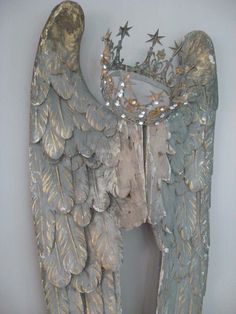 an angel statue with stars on its wings