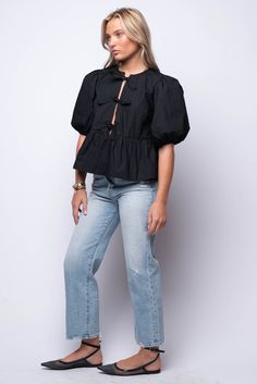 Elevate your everyday look with our Carmine Blouse. This puff sleeve blouse boasts delicate tie details on the front, adding a touch of elegance. The ruffle hem adds a feminine flair! 100% Cotton Hand Wash Cold Import Fit Guide: Hannah is 5ft 5 inches, Bust 32”, Waist 25”, Hips 29” Model is wearing a size small True to size *Available at our Envy location Chic Spring Puff Sleeve Top With Tie Sleeves, Casual Blouse With Puff Tie Sleeves, Workwear Blouse With Ruffle Hem And Puff Sleeves, Spring Puff Sleeve Top With Tie Sleeves, Lavender Brown, Katie May, Kimono Duster, Beach Riot, Capri Blue