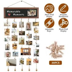 a wooden sign hanging from the side of a wall with pictures on it and clips attached to them