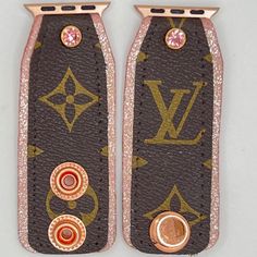 two pink and brown leather cases with gold hardwares on the sides are decorated with swarovs