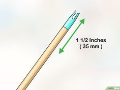 a pencil with an eraser on the tip labeled 1 / 2 inches 35 mm