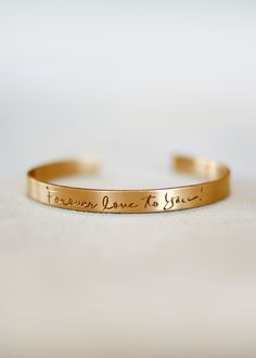 This beautiful cuff is meant for the special someone in your life to keep a saying or phrase close to them. All we need is the handwritten phrase, sentence, or signature and we can engrave it onto a Sterling Silver, Goldfill, or Rose Goldfill cuff. Cuffs are available in 1/6 inch thickness, 1/4 inch thickness or 3/8 inch thickness *Please email a photo of the phrase you would like engraved to: sarah@kristinhayesjewelry.com Engraved Handwriting, Engraved Cuff, Hand Engraving, Vintage Charms, Personalized Jewelry, Handcrafted Jewelry, We Need, Costume Jewelry, Or Rose