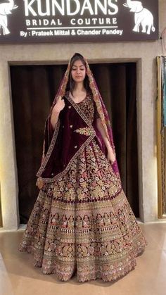 a woman in a bridal gown poses for the camera at kundan's bridal couture