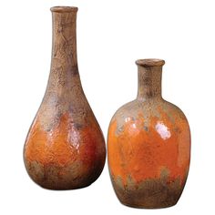 two brown and orange vases sitting side by side