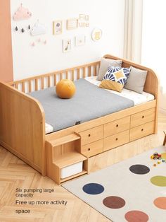 a child's bed with storage drawers in the bottom drawer and an area rug on the floor