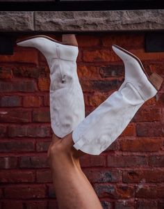 The hottest trend of 2022 are white boots no doubt and these fit the bill. Man made upper. Leather wrapped heel. Shaft height is 13.75". Heel height is 2.5". Half zip closure. Boot opening is 15" circumference. Running true to size. If you toggle between two sizes, go with your larger size. White Knee-high Boots For Spring, Trendy White Knee-high Heeled Boots, White Pointed Toe Mid-calf Boots Medium Width, White Mid-calf Boots With Pointed Toe, White Fitted Mid-calf High Ankle Boots, White Western Knee-high Boots With Wide Calf, White Wide Calf Western Knee-high Boots, White Western Heeled Boots For Fall, White Wide Calf Knee-high Boots For Fall