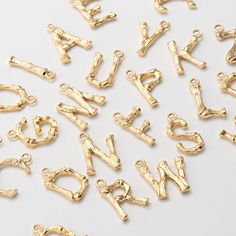 4PCS - Bamboo Alphabet Initial, Letter Bamboo charms, Dangle Personalized Pendant, Bamboo necklace, Real 14K Gold Plated [P0906-PG] Item Details Measurement: width : 10x17mm - (ring size : .3.5mm, thickness : 1mm)  Material: Brass Color:  Real 14K Gold Plated Quantity: 4 Pieces Country of Origin : South Korea **Related Item https://www.etsy.com/listing/675029703/gold-hoop-12mm-earring-vintage-hoop?ga_search_query=hoop&ref=shop_items_search_2&crt=1 **Birthstone Related items p0369: https://www.etsy.com/shop/DesignInYourHeart/search?search_query=p0369&view_type=list&ref=shop_search p0368: https://www.etsy.com/shop/DesignInYourHeart/search?search_query=p0368&view_type=list&ref=shop_search p1250: https://www.etsy.com/shop/DesignInYourHeart/search?search_query=p1250&view_type=list&ref=shop_sear Gold Dangle Charm Necklaces For Anniversary, Gold Initials Pendant Charm, Gold Pendant Charms With Initials, Bamboo Necklace, L Alphabet, Letter Charm, Personalized Pendant, Letter Charms, Initial Letter