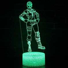 an illuminated figure is standing on top of a green cake with the outline of a man