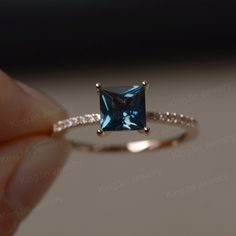 This is a gorgeous handmade creation. Its beauty is its simplicity & Elegance. The 6*6mm princess cut London blue topaz is crafted in solid 14k gold. It is available to customized, if you have any mind, just let me know, we will discuss with it. All item is sent in a beautiful gift box You can realize more lovely stuff clicking the link https://www.etsy.com/shop/knightjewelry?refshopsection_shophome_leftnav Please leave the correct address and you PHONE NUMBER for delivering successfully. Elegant Princess Cut Sapphire Promise Ring, Elegant Solitaire Princess Cut Topaz Ring, Elegant Princess Cut Solitaire Topaz Ring, Elegant Princess Cut Diamond Topaz Ring, Elegant Princess Cut Topaz Ring With Diamond, Elegant Princess Cut Topaz Ring, Elegant Square Cut Topaz Ring Gift, Elegant Blue Topaz Princess Cut Jewelry, Elegant Princess Cut Blue Topaz Ring