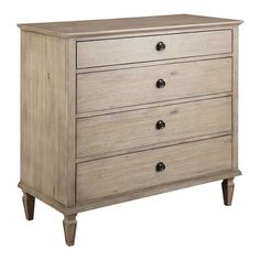 the chest of drawers is made from wood and has three drawers, one with two handles