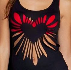 a woman wearing a black and red top with cut out heart on the chest,