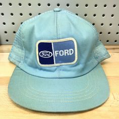 Vintage FORD Motors Light Blue Mesh Back Farmer Trucker Hat 70's Made in USA Cap. The size listed on the inner tag is 7 1/4 - 7 5/8. A very cool old hat indeed. Condition is Good, Vintage Pre-Owned. Being a good, vintage pre-owned hat, signs of wear/age/storage are present. Specifically, this hat does show some discoloration, staining, sweatband staining, a wavy/bent brim, etc. Please review photos prior to purchase.  Shipped via USPS First Class Package with Tracking. *Please note, all hats are Vintage Blue Adjustable Trucker Hat, Vintage Blue Snapback Baseball Cap, Vintage Blue Adjustable Baseball Cap, Vintage Adjustable Blue Baseball Cap, Vintage Blue Hat With Flat Brim, Vintage Blue Flat Brim Hat, Blue Retro Adjustable Trucker Hat, Retro Blue Adjustable Trucker Hat, Retro Blue 5-panel Trucker Hat