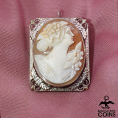 Metal: 14k Yellow Gold Weight: 6.0 grams Measurements: 1.3"" x 1.0" (length x width) *Delicately hand-carved this beautiful cameo brooch/pendant features an image of a woman looking right, set in a 14k yellow gold floral frame. This outstanding Victorian cameo is in beautiful condition, with light wear & patina. Don't let this exquisite brooch escape your grasp and add to your cart today! *Please See Photos! Heirloom Style Carved Brooch For Gifts, Heirloom Carved Brooches As Gift, Victorian Cameo, Woman Looking, Floral Frame, Cameo Brooch, Gold Floral, Bouquets, Art Nouveau