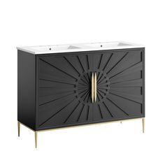 a black cabinet with gold accents and a white sink in the center, on a white background