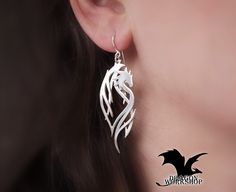 "Earrings \"Dragon Guardian\" Earrings are made in the kit to the Cuff \"Dragon Guardian\". It's very original, delicate and elegant decoration that is sure to attract attention. The earrings is made in the form of a dragon guardian, they will defend and protect you. Dragons will bring strength and confidence. The decoration is very elegant and easy, they are will be mascots in any situation. Possible materials of manufacture: \"Silver\" -  Nickel Silver (Jewelry alloy of silver color, does not contain silver. Other name: Maillechort, German silver.) \"Gold\" - Brass (Jewelry alloy of gold color) \"Sterling Silver\" - 925 Sterling Silver (This is a precious 925 alloy) All the jewelry in my shop is made by hand. With love and individually. This means that minor differences from the original Handmade Fantasy Wrap Earrings As A Gift, Fantasy Style Metal Single Earring, Fantasy Metal Single Earring, Fantasy Style Silver Cartilage Earrings For Gifts, Silver Fantasy Style Cartilage Earrings As Gift, Silver Dangle Fantasy Earrings, Fantasy Style Pierced Cartilage Earrings For Gift, Silver Fantasy Cartilage Earrings For Gift, Fantasy Style Drop Earrings For Gift