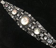 One look at this bracelet and it automatically screams SELRO !! This is a stunning mid-century designer high end collectible vintage bracelet.  In very good condition.  THE METAL IS GOLD TONE WITH CLEAR RHINESTONES. THE BRACELET IS APPROX. 1 1/2" WIDE. THE LENGTH IS 7 1/2".  Circa: Mid Century 1950's Stunning jewelry to add to the little black dress or add to a great high end costume jewelry collection. Thanks for stopping by... Come by my shop & take a peek for alot more... www.etsy.com/shop/ma Vintage Bling Bracelets As Gifts, Vintage Crystal Bracelet Gift, Vintage Metal Bracelets For Evening, Vintage Metal Bracelets For Evening Wear, Vintage Metal Bracelets With Bling, Vintage Silver Bangle Crystal Bracelet, Vintage Silver Crystal Bangle Bracelet, Vintage Round Crystal Bracelet For Formal Occasions, Vintage Crystal Bracelet For Wedding