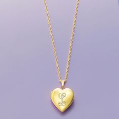 Ross-Simons - Plain - 14kt Yellow Gold Heart Locket Necklace. 20". Make her day with our luxe symbol of love! Crafted in polished 14kt yellow gold, our heart locket necklace is a timeless choice for so many occasions. Fits a 5/16" x 3/8" photo inside. Suspends from a rope chain. Springring clasp, 14kt yellow gold heart locket necklace. Gold Heart Pendant Locket Necklace With Hallmark, Elegant Locket Necklace With Hallmark For Mother's Day, Gold Locket Necklace With Hallmark For Mother's Day, Gold Locket Necklace For Mother's Day With Hallmark, Gold Locket Necklace For Mother's Day, Gold Heart Pendant Locket Necklace Stamped 14k, Elegant Locket Necklace For Anniversary With Hallmark, Elegant Yellow Gold Locket Necklace For Valentine's Day, Elegant Personalized Medallion Heart Necklace