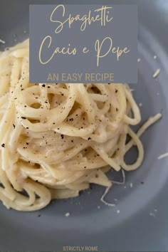 a blue plate topped with pasta and sauce