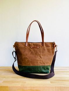 Brown Canvas Bag With Handles, Green Canvas Tote Weekender Bag, Large Capacity Duck Canvas Bag For Everyday Use, Duck Canvas Rectangular Weekender Bag For Everyday Use, Duck Canvas Weekender Tote Bag For Everyday Use, Brown Waxed Canvas Weekender Bag With Large Capacity, Everyday Brown Duck Canvas Bag, Rectangular Duck Canvas Weekender Bag For Everyday Use, Everyday Brown Canvas Bucket Bag