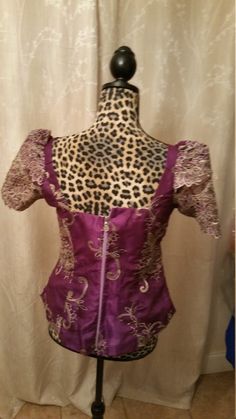 Lace blouse can be used on a skirt, pant ND African fabric. Traditional Fitted Evening Tops, Fitted Evening Sets With Short Sleeves, Fitted Purple Blouse For Party, Purple Silk Evening Top, Party Sets With Unstitched Short Sleeve Blouse, Fitted Dress With Padded Blouse, Purple Silk Evening Blouse, Elegant Purple Silk Blouse, Festive Formal Fitted Tops