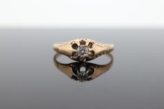 This one is an incredible find. Early 20th century 14k Yellow gold with a round diamond belcher set. Engraving on the sides. Details: 3.5mm diamond SI clarity and G color.  1.5gram total weight SZ 8.75 Will truly make a unique ring for any occasion. Antique Diamond Promise Ring Stamped 14k, Antique 14k Stamped Round Cut Diamond Ring, Victorian 14k Stamped Diamond Promise Ring, Antique Engraved Diamond Ring Stamped 14k, Antique 14k Gold Diamond Ring Stamped 14k, Antique 14k Gold Single Diamond Ring, Vintage 14k Gold Filigree Ring With Diamond Accents, Antique 14k Gold Diamond Ring With Round Cut, Antique Diamond Ring With Single Diamond