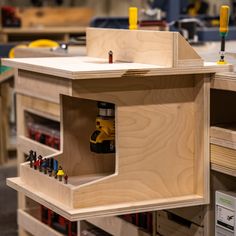 a workbench with tools in it and lots of other woodworking supplies on the shelves