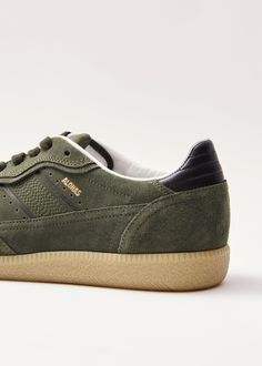 Khaki sneakers with leather details Coming in fall’s favorite shade of green, the Tb.490 sneaker is made from suede with brown leather details. Designed in a low-top silhouette sitting on rubber soles, it’s complete with plenty of classic features, including subtle perforation and logo stamps. Olive Low-top Leather Sneakers, Green Low-top Leather Platform Sneakers, Olive Lace-up Sneakers For Outdoor, Brown Lace-up Sneakers With Textured Sole, Green Suede Lace-up Sneakers, Olive Sneakers, Headphone Accessories, Sustainable Leather, Vegan Boots