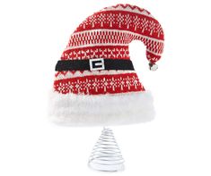 a red and white santa hat on top of a metal stand