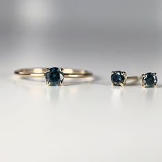 "14k yellow gold and blue diamond stud earrings. They will make a great companion to your beautiful wedding. They are very elegant for daily use or for official gatherings. SOLD AS PAIR. Material; 14k solid gold studs Round blue diamonds are 3mm Prong settings. 14k gold backings included. On the pictures you see 14k solid gold hammered bar studs are available from this link; https://www.etsy.com/listing/953435550/14k-gold-hammered-bar-stud-earrings-tiny? Matching ring is available here https://w Wedding Rings In Yellow Gold With Matching Earrings, Yellow Gold Wedding Rings With Matching Earrings, 14k Yellow Gold Solitaire Earrings, Blue 14k Gold Earrings For Wedding, Blue Diamond Earrings, Stud Earrings Diamond, Blue Diamonds, Bar Stud Earrings, Matching Ring