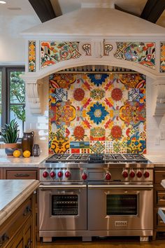 a stove top oven sitting inside of a kitchen next to a wall covered in colorful tiles