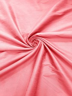 a close up shot of a pink fabric