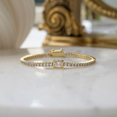 This stunning tennis bracelet features a bezeled emerald cut charm, adding a touch of elegance to any jewelry collection. It sparkles like real diamonds and shines beautifully, making it perfect for both special occasions and everyday wear. Versatile in style, this bracelet can be worn alone for a timeless look or stacked with other bracelets for a trendy layered effect. Ideal as a gift for birthdays or anniversaries, it’s also a lovely treat for yourself. Crafted with high-quality materials, th Bracelet Tennis, Wedding Bridesmaid Jewelry, Chunky Earrings, Jewelry Bridesmaid, Stacked Jewelry, Dainty Bracelets, Initial Jewelry, Statement Bracelet, Sapphire Jewelry