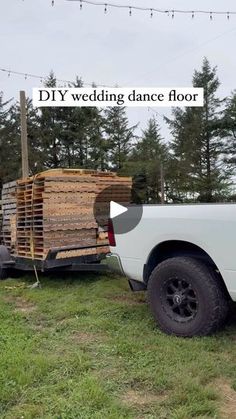 a white truck is loaded with wooden pallets for the bride and groom to be married