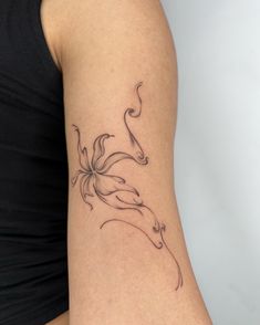 a woman's arm with a tattoo design on the left side of her body