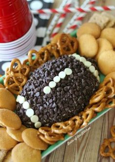 a football themed plate with pretzels and cookies