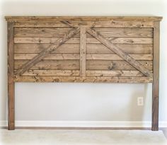 a bed frame made out of wood with the words barn - style headboard