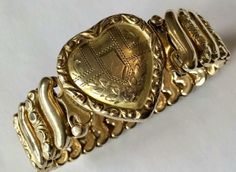 Antique 12K Gold filled sweetheart expansion bracelet 1930s ( Memoir of a 1938 Valentine's day gifting, on the bottom of the box) This sweetheart bracelet has Not been engraved , so it is ready for you to do so , if desired! Marked : 'Leading Lady ' 'Made in USA ' Excellant Condition! Will come with the original , beautiful velvet box as shown. *A majority of these jewelry pieces were produced in the Forties , Gold Filled, ( NOT plated ) and given to a sweetheart , by an American Soldier away on Vintage 14k Stamped Bracelets For Anniversary, Vintage 14k Gold Stamped Bracelets For Anniversary, Antique 14k Stamped Bracelets For Anniversary, Victorian Style Gold Jubilee Bracelet For Gift, Antique Engraved Bracelets For Gifts, Vintage 14k Stamped Bracelets, Vintage Heart Bracelets For Formal Occasions, Victorian Engraved Bracelets For Gifts, Victorian Engraved Bracelets As Gift