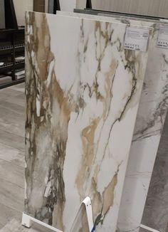 a white and brown marble counter top in a store