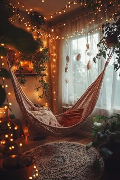 a hammock hanging in front of a window filled with lights