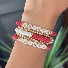 University of Oklahoma OU Boomer Sooner bracelets! Great birthday gift or graduation gift for an OU student, fan, grad, alumni, mom, the list is endless! 14k Gold stacking bracelet can be found here: https://braceletisland.etsy.com/listing/1416856385 Burlap Gift Bag w/Tag can be found here... https://braceletisland.etsy.com/listing/1587395371  SIZE  * Stretch Bracelet, size is approximately 6 3/4"-7" (fits small to medium wrists). If you need a different size please let us know in notes at checkout!  PACKAGING  * Each bracelet order will be presented with a Bracelet Island presentation card and wrapped in brown paper dotted w/gold specs and tied with a burlap string. Ready to give as a gift!  CARE  * Made from high quality, long lasting beads with a sturdy stretch cord.   * Keeps lotions a Personalized Red Beaded Bracelets With Letter Beads, Personalized Red Name Bracelet With Letter Beads, Adjustable Red Beaded Bracelets For Personalized Gift, Red Custom Name Bracelet For Friendship, Personalized Red Friendship Bracelets For Everyday, Personalized Red Friendship Bracelets, Red Personalized Friendship Bracelets, Personalized Red Letter Beads Bracelet, Everyday Personalized Red Friendship Bracelets