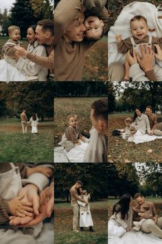 a man and woman holding a baby in their arms while they are sitting on the grass