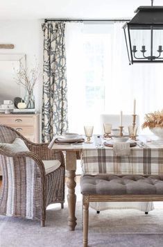 the dining room table is set with place settings