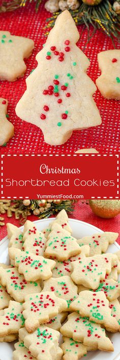 christmas shortbread cookies with sprinkles on a white plate and red tablecloth