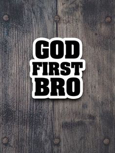 a sticker that says god first broo on the side of a wooden surface